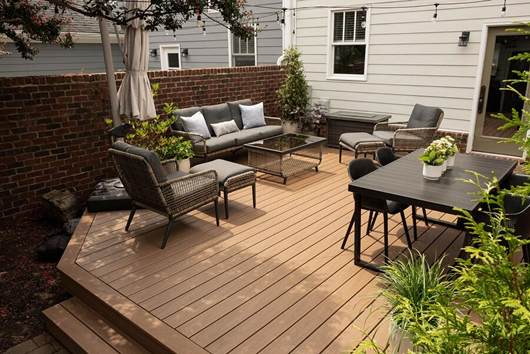 Outdoor decking area with modern garden furniture.