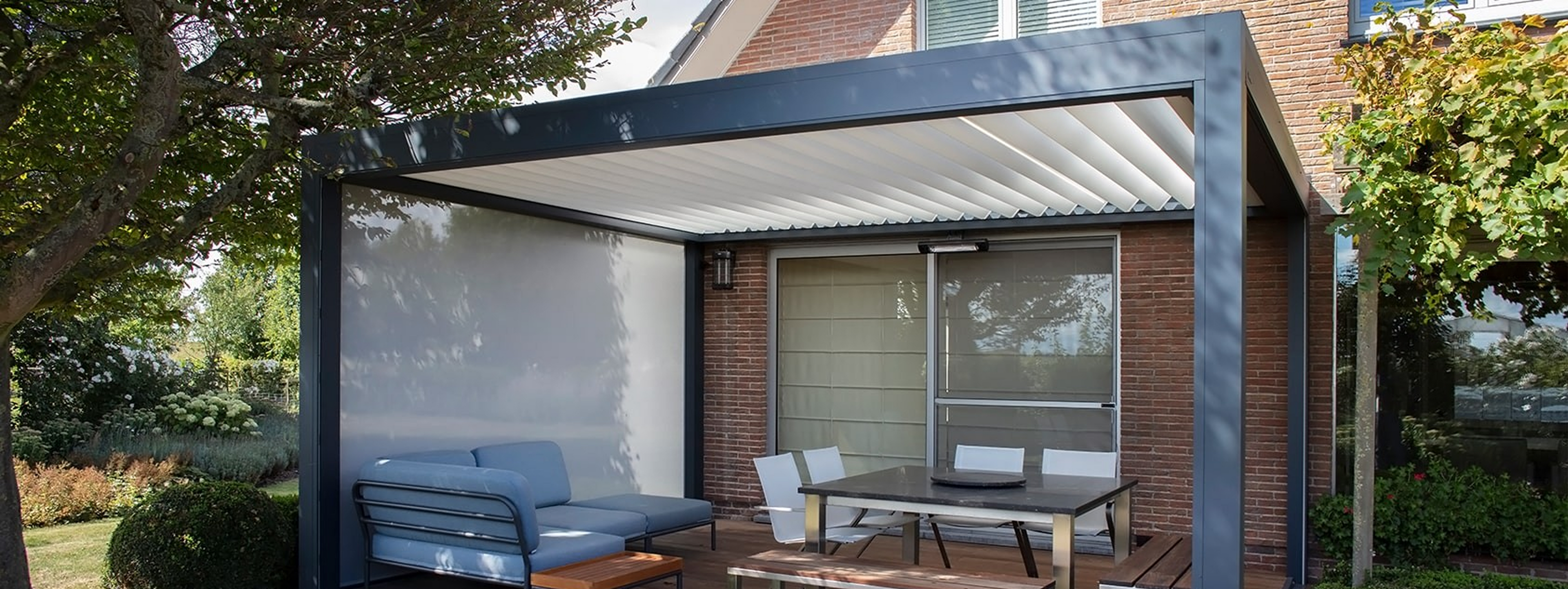 Modern patio with metal pergola and outdoor seating.