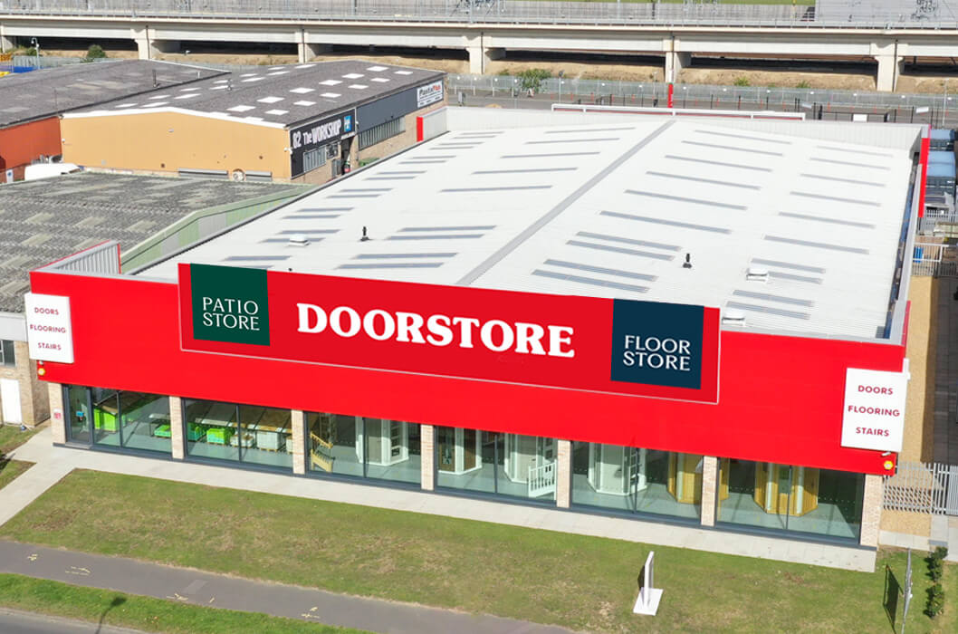 Aerial view of a Doorstore store with a red and white facade.