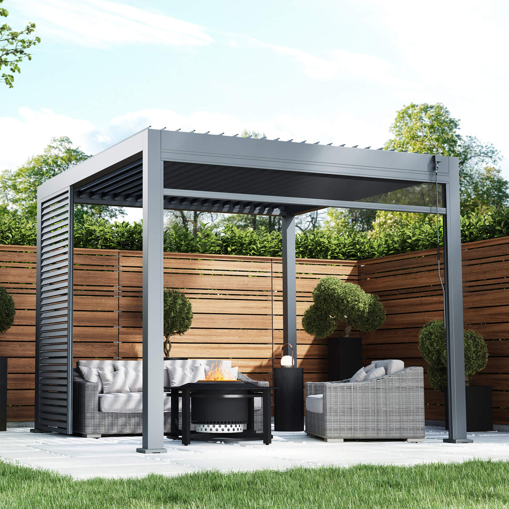A Riva 3x3m Aluminium Pergola, with outdoor furniture, and fire pit in an outdoor garden patio setting. 